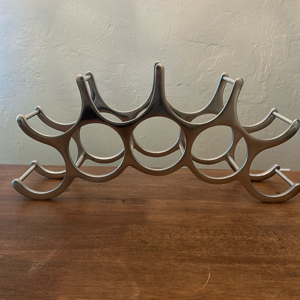 Polished aluminum 9 bottle wine holder